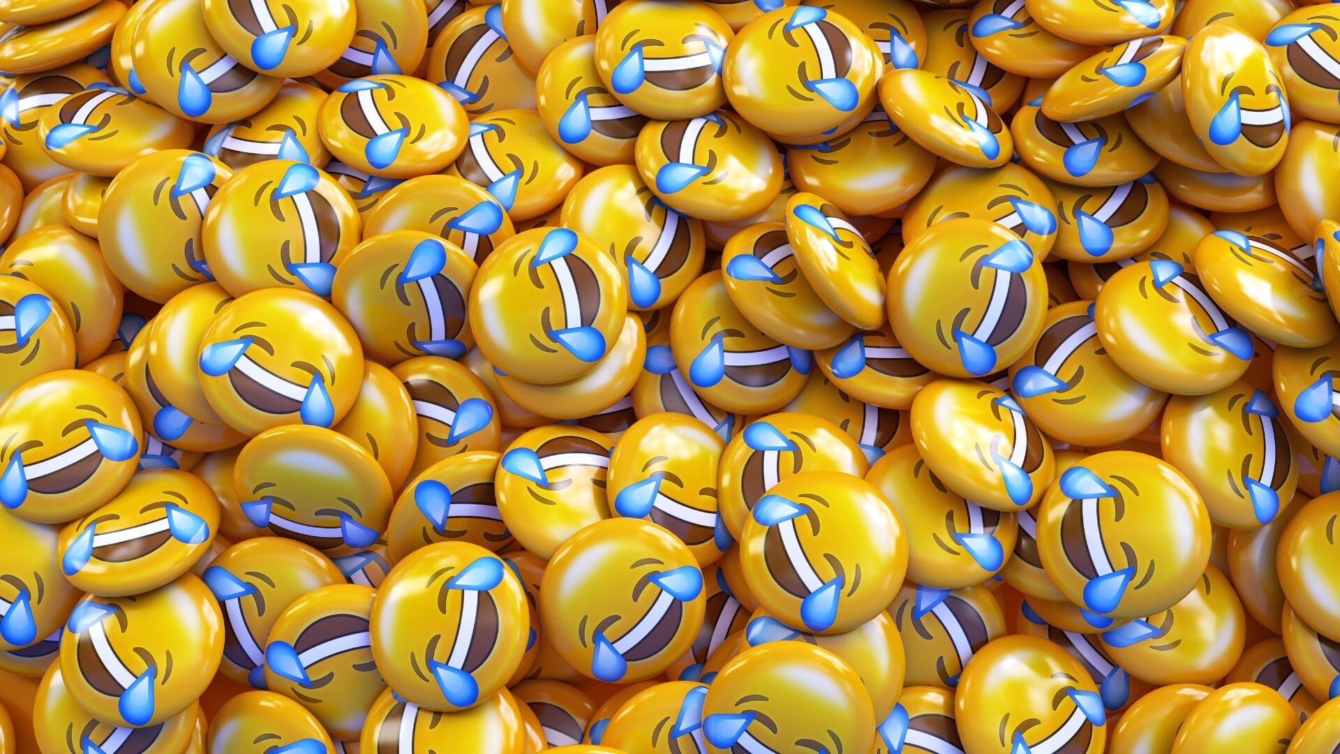 Pile of yellow "Face with Tears of Joy" emojis symbolizing emotional expression and misinterpretation in digital conversations