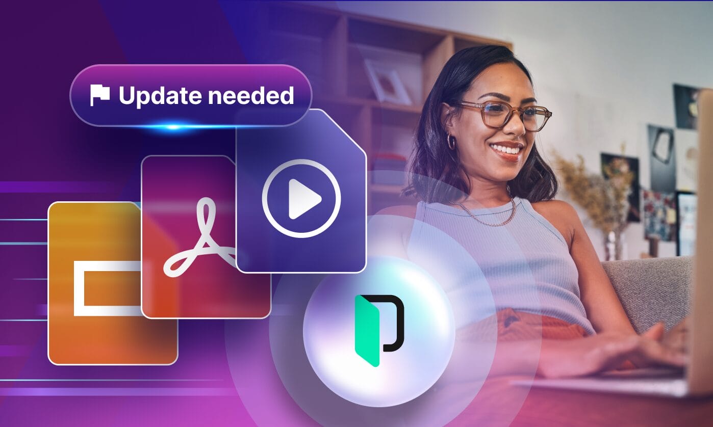 Portrait of Phrase’s learning and development manager smiling and working at a laptop, shown in a professional setting