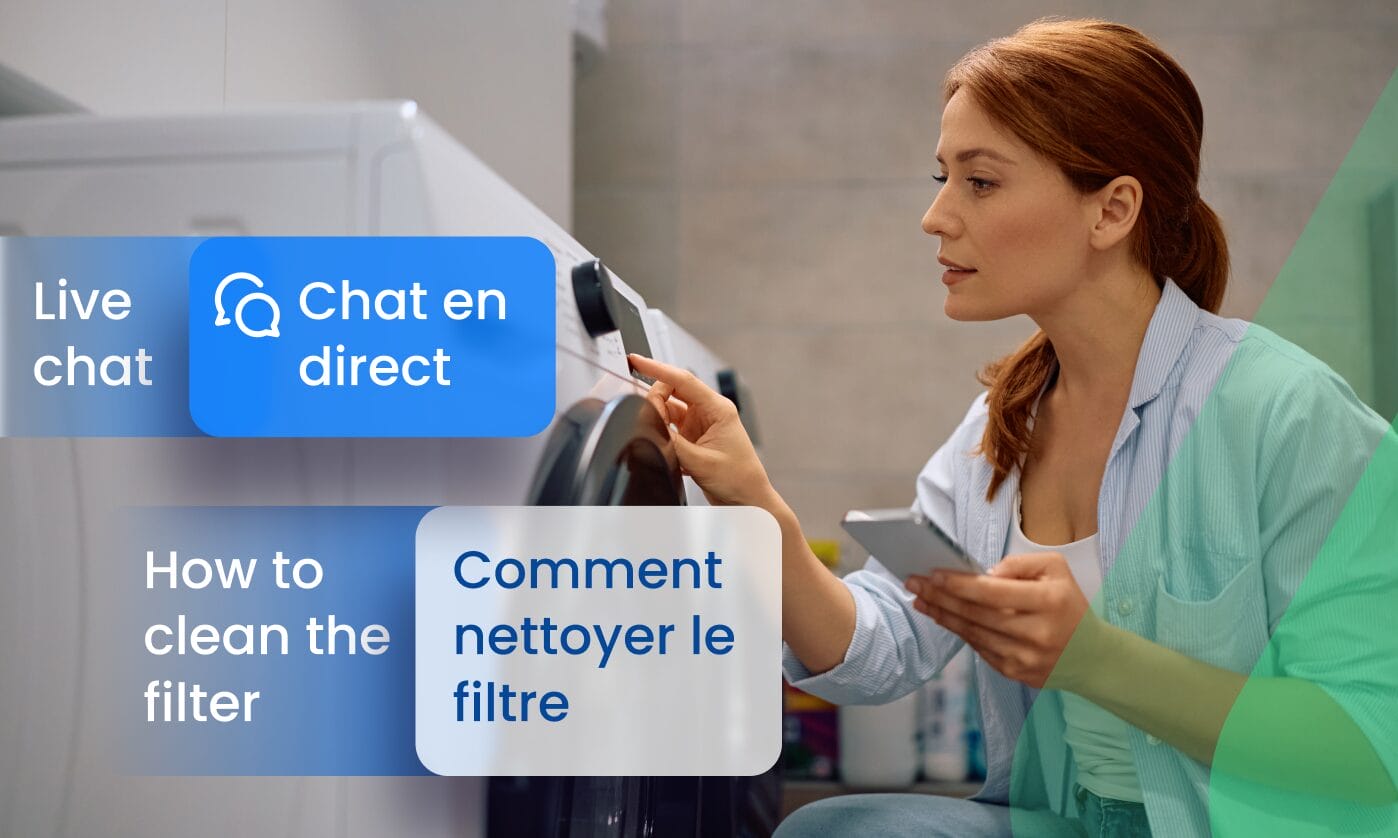 A woman consulting her phone while using a washing machine, with UI labels showing English to French localization of customer support content — "Live chat" translated as "Chat en direct" and "How to clean the filter" as "Comment nettoyer le filtre" — illustrating Phrase localization for customer support and product documentation.
