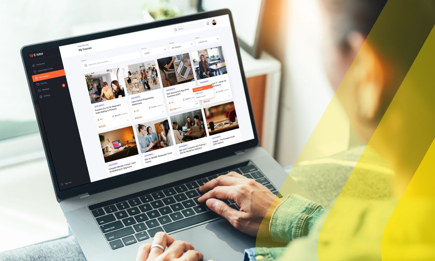 A person browsing an e-learning platform dashboard showing a course library with development courses, illustrating Phrase localization for learning and training content.